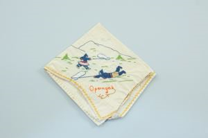 Image of Operngak: two figures with insect nets, one of a set of 2 embroidered napkins with seasons Operngak and Okiaksak